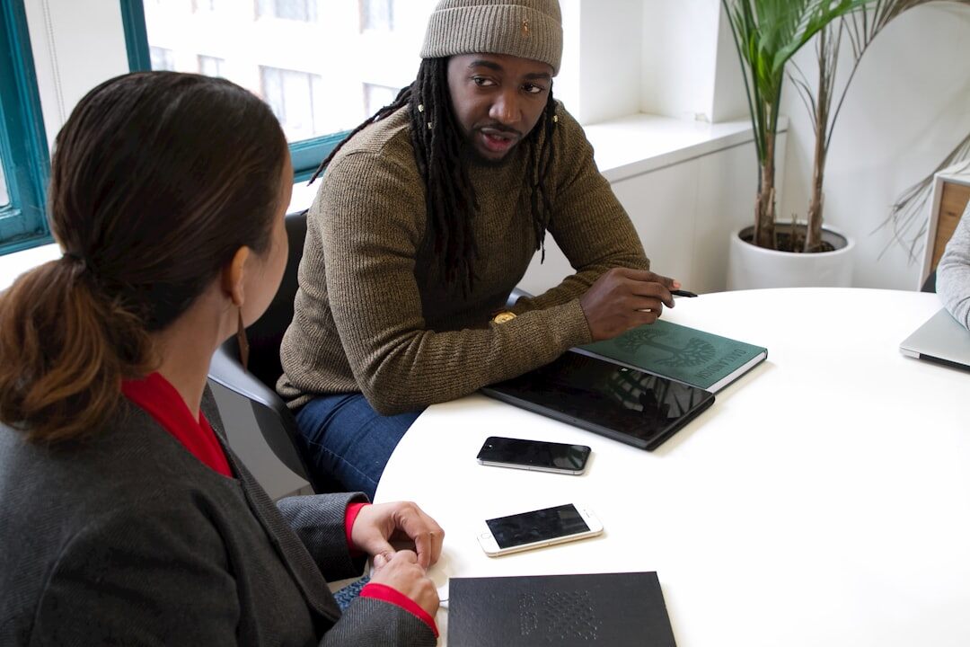 Mentor and mentee reviewing notes together at a table