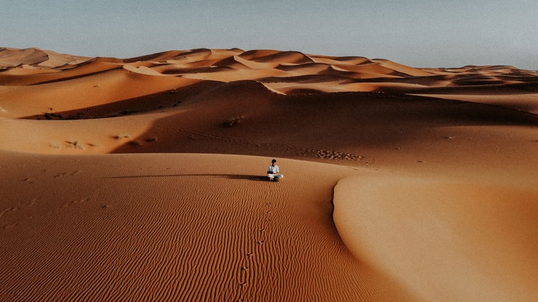 person meditating alone in nature
