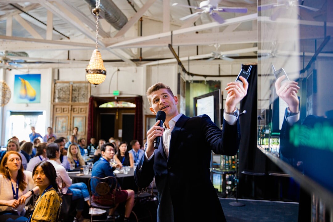 Speaker gesturing while presenting to an attentive audience
